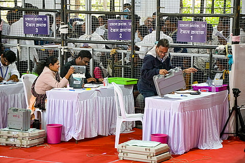 Polling officials during counting of votes for the Nagpur Municipal Corporation election, at a centre in Nagpur, Maharashtra.