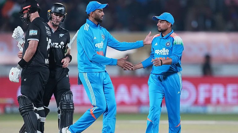India's Prasidh Krishna congratulates India's Kuldeep Yadav after taking the wicket of New Zealand's Will Young during the second One Day International cricket match between India and New Zealand in Rajkot, India, Wednesday, Jan. 14, 2026. - | Photo: AP/Ajit Solanki