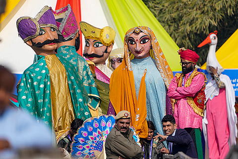 Police official and artistes during the third ‘International Kite Festival’, at Baansera Park, in New Delhi.
