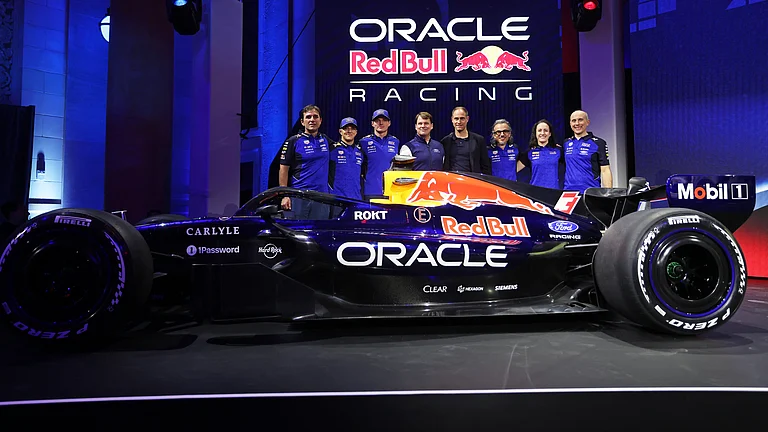 Oracle Red Bull Racing team posing with the new F1 car. - Mark Thompson/Getty Images