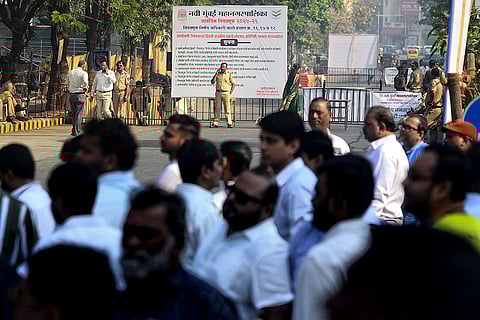 Security personnel keep vigil outside a centre during counting of votes for the Navi Mumbai Municipal Corporation election, at Vashi, in Navi Mumbai.