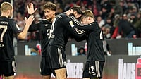 Bundesliga Matchday 18 Preview: Bayern In Control, Leipzig Chase Champions League Spot | Photo: AP/Martin Meissner : Bayern's Lennart Karl, right, celebrates with teammates after scoring his side's third goal during the German Bundesliga soccer match between 1.FC Koeln and FC Bayern Munich in Cologne, Germany, Wednesday, Jan. 14, 2026.