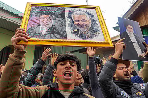 Agitators hold portraits of Iran's Supreme Leader Ayatollah Ali Khamenei and late general Qassem Soleimani during a protest by Shia Muslims in support of the Islamic Republic, amid the deadly protests challenging Iran's theocracy and threats by the US to intervene militarily in the country, in Srinagar.