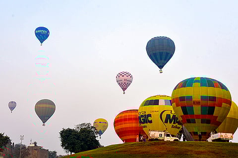 Hot air balloons carry passengers during the Hot Air Balloon Festival, being organised by Telangana Tourism, in Hyderabad.