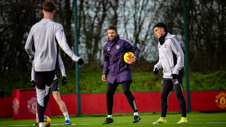 Michael Carrick takes charge of training ahead of the Manchester derby. - null