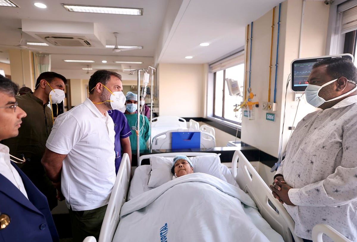In this image posted on Jan. 17, 2026, LoP in the Lok Sabha and Congress leader Rahul Gandhi meets a patient undergoing treatment after alleged consumption of contaminated water, at Bombay Hospital, in Indore.  - (@INCIndia/X via PTI Photo)
