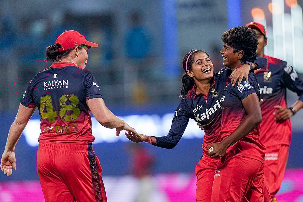 Royal Challengers Bengaluru players celebrate their victory during the Women's Premier League (WPL) T20 cricket match between Royal Challengers Bengaluru and Gujarat Giants, at the DY Patil Stadium, in Navi Mumbai.
 - | Photo: PTI/Kunal Patil