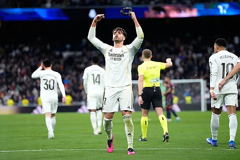 Real Madrid's Raul Asencio reacts after scoring his side's second goal during the Spanish La Liga soccer match between Real Madrid and Levante in Madrid, Spain.