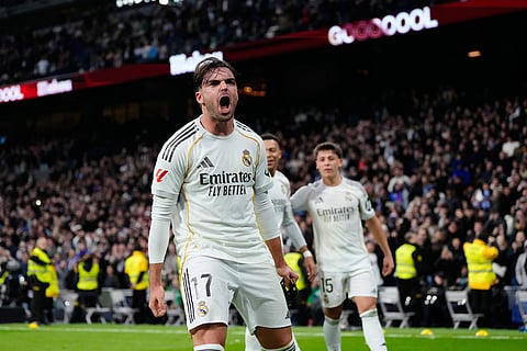Real Madrid's Raul Asencio celebrates after scoring his side's second goal during the Spanish La Liga soccer match between Real Madrid and Levante in Madrid, Spain.