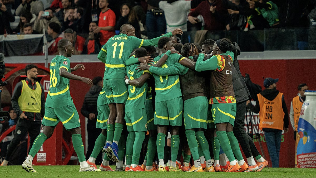 Senegal's players celebrate during their semi-final win over Egypt - File