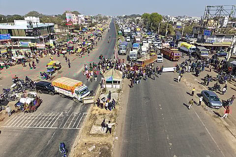 Agitators block roads during Jharkhand 'bandh', called to protest the murder of a tribal village head, Soma Munda, in Khunti district of Jharkhand.