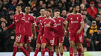 | Photo: AP/Jon Super : Premier League 2025-26 Live Scores, Saturday Goal Rush: Liverpool players walk to the ceneter after scoring during the FA Cup third round soccer match between Liverpool and Barnsley in Liverpool, England.