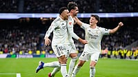 Photo: AP : Raul Asencio, centre, celebrates with teammates Kylian Mbappe, left, and Arda Guler after scoring his side's second goal during the Spanish La Liga match between Real Madrid and Levante in Madrid, Spain.
