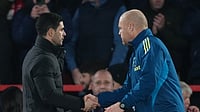 (AP Photo/Dave Shopland) : Arsenal's manager Mikel Arteta, left, and Nottingham Forest's head coach Sean Dyche shake hands at the end of the English Premier League soccer match between Nottingham Forest and Arsenal in Nottingham, England, Saturday, Jan. 17, 2026.