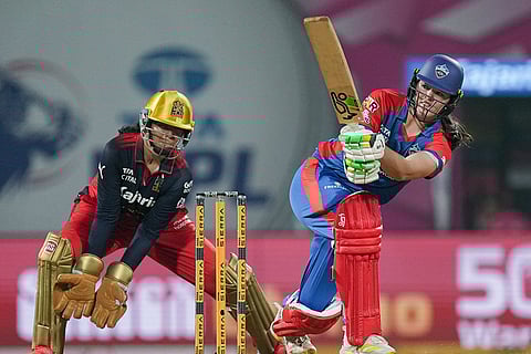 Delhi Capitals' Lucy Hamilton plays a shot during the Women's Premier League (WPL) T20 cricket match between Royal Challengers Bengaluru and Delhi Capitals, at the DY Patil Stadium, in Navi Mumbai.