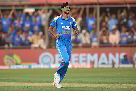 India's Arshdeep Singh celebrates the wicket of New Zealand's Zak Foulkes during the third One Day International cricket match between India and New Zealand in Indore, India.
