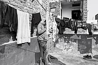 | Photo: Mrinalini Dhyani : Life, Altered: Mohammad Iqbal stands in the balcony of his mother-in-law’s house in one of the localities of North-east Delhi