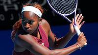 AP Photo/Dar Yasin : Coco Gauff of the United States plays a backhand return during a practice session ahead of the Australian Open tennis championship in Melbourne, Australia, Saturday, Jan. 17, 2026. 