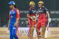 WPL 2026: Smriti Mandhana’s 98 Powers RCB To Emphatic Win Over DC | Photo: PTI/Kunal Patil : Royal Challengers Bengaluru's Richa Ghosh, left, shakes hands with teammate Georgia Voll at the end of play during the Women's Premier League (WPL) T20 cricket match between Royal Challengers Bengaluru and Delhi Capitals, at DY Patil Stadium, in Navi Mumbai.