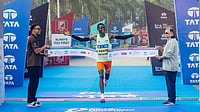 Special Arrangement : Ethiopia’s Tadu Abate Deme crosses the finish line to win the overall men’s title at the Mumbai Marathon 2026.