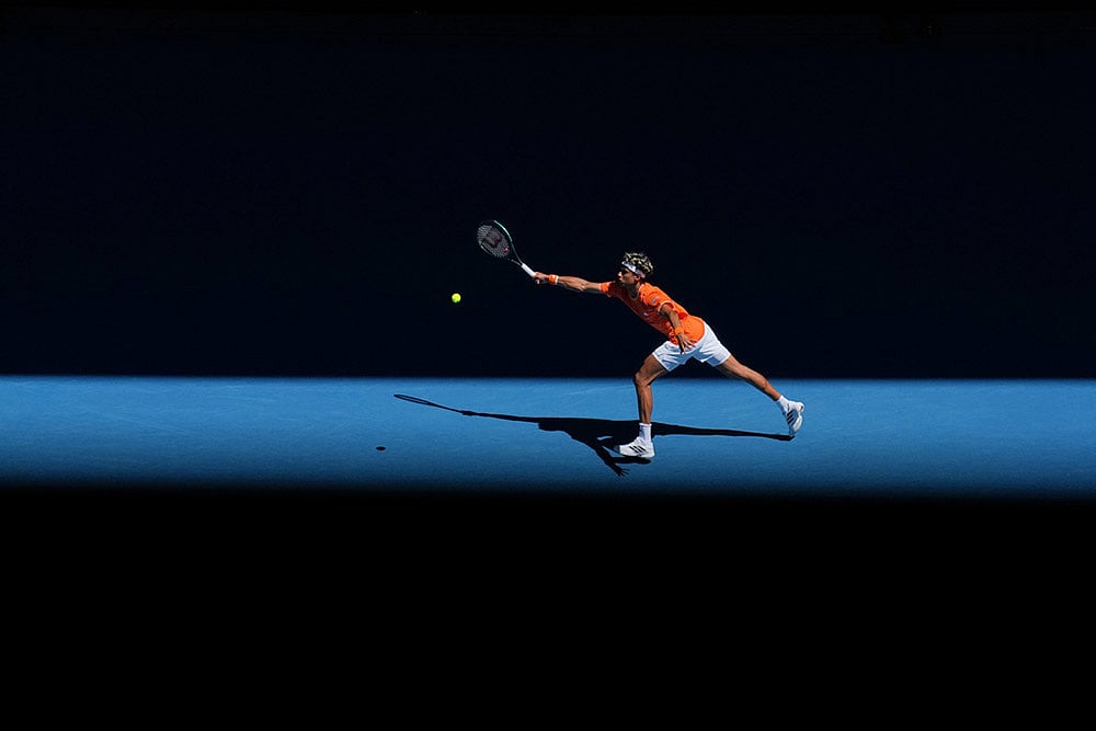 Gabriel Diallo of Canada plays a forehand return to Alexander Zverev of Germany