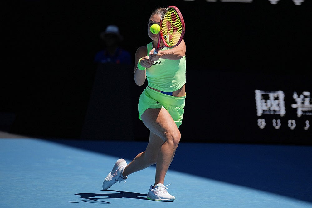 Jasmine Paolini of Italy plays a backhand return to Aliaksandra Sasnovich