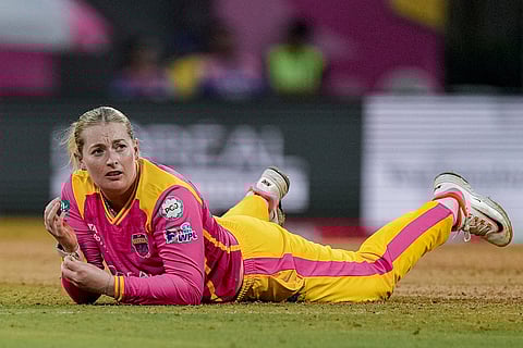 UP Warriorz's Sophie Ecclestone during the Women's Premier League (WPL) T20 cricket match between Mumbai Indians and UP Warriorz, at the DY Patil Stadium, in Navi Mumbai.