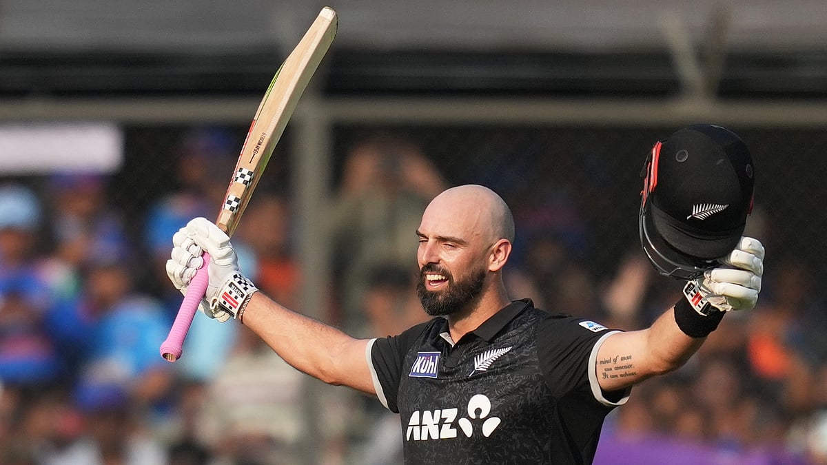 New Zealand's Daryl Mitchell celebrates his century during the third One Day International cricket match between India and New Zealand in Indore, India, Sunday, Jan. 18, 2026 - (AP Photo/Rafiq Maqbool)
