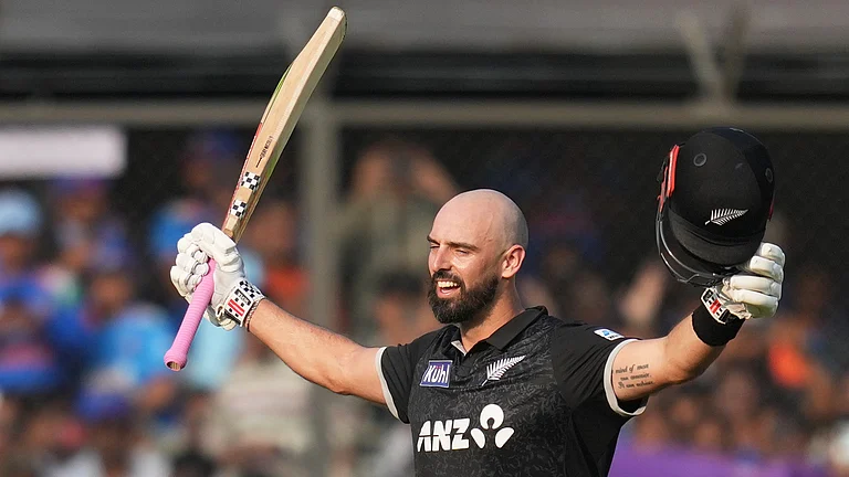 New Zealand's Daryl Mitchell celebrates his century during the third One Day International cricket match between India and New Zealand in Indore, India, Sunday, Jan. 18, 2026 - (AP Photo/Rafiq Maqbool)
