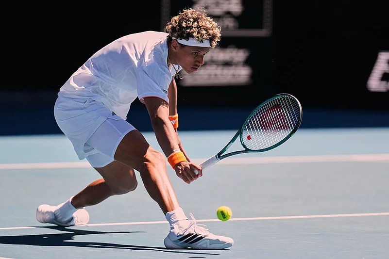Gabriel Diallo of Canada plays a backhand return to Alexander Zverev of Germany