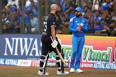 India's Virat Kohli, right, applauds as New Zealand's Daryl Mitchell leaves the field after losing his wicket during the third One Day International cricket match between India and New Zealand in Indore, India.