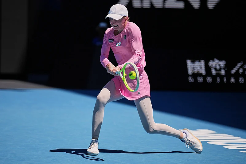Aliaksandra Sasnovich of Belarus plays a backhand return to Jasmine Paolini