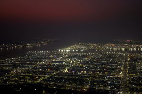 Lights are lit in temporary tents housing pilgrims at "Sangam," the confluence of the Ganges and Yamuna and mythical Saraswati river, on "Mauni Amavasya" or new moon day, during the annual month long Hindu religious fair "Magh Mela" in Prayagraj.