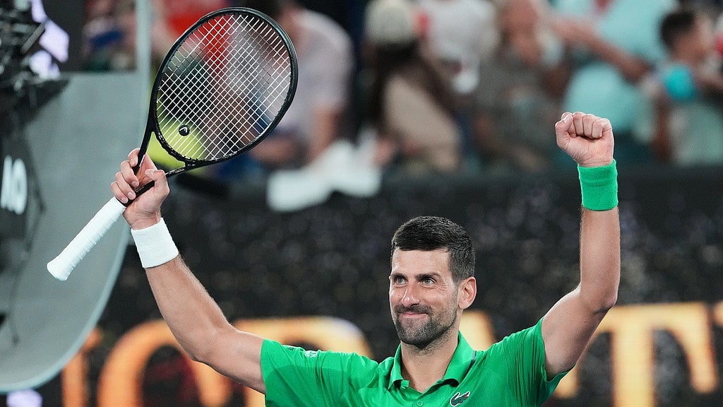 Novak Djokovic of Serbia celebrates after defeating Pedro Martinez of Spain in their first round match at the Australian Open tennis championship in Melbourne. - Photo: AP