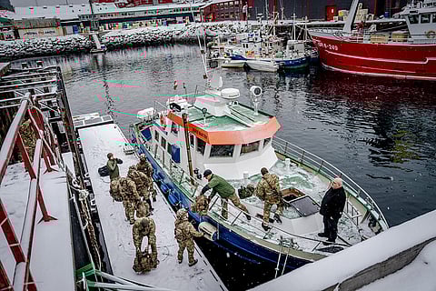 Danish soldiers disembark at the harbor in Nuuk, Greenland.