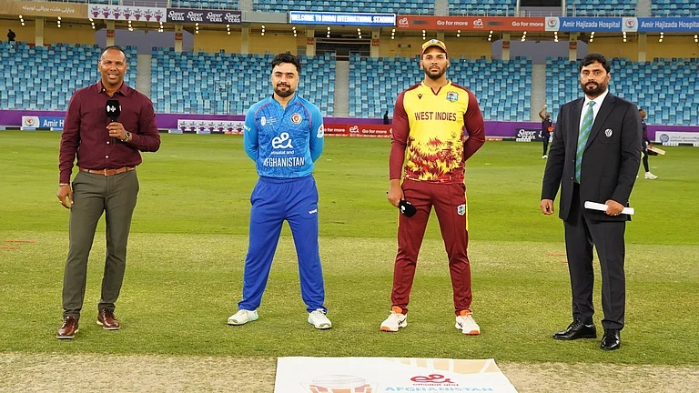 Captains Rashid Khan and Brandon King at the toss for the first T20 international between Afghanistan and West Indies in Dubai. - X/Afghanistan Cricket Board