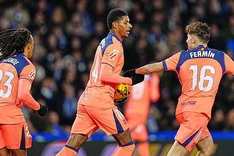 Barcelona's Marcus Rashford, centre, celebrates after scoring his side's opening goal during the Spanish La Liga soccer match between Real Sociedad and Barcelona in San Sebastian, Spain.