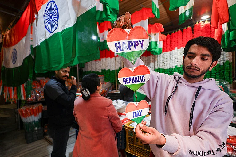 A shopkeeper displays tricolour-themed items for sale ahead of Republic Day, in Jammu. - | Photo: PTI