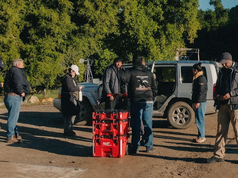 Film crew and actors gathered on an outdoor set during a location shoot