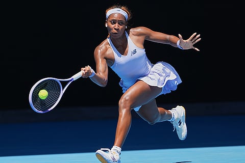 Coco Gauff of the U.S. plays a forehand return to Kamilla Rakhimova of Uzbekistan during their first round match at the Australian Open tennis championship in Melbourne, Australia.