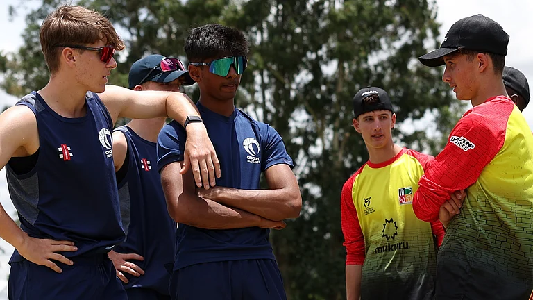 Scotland U19 players with Zimbabwe U19 players before their ICC U-19 Cricket World Cup match on January 15, 2026. - | Photo: X/CricketScotland