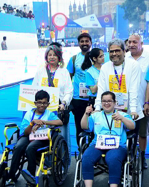 Bollywood filmmaker Vishal Bhardwaj with his wife Rekha Bhardwaj during the Tata Mumbai Marathon 2026, near Chhatrapati Shivaji Maharaj Terminus (CSMT) in Mumbai.