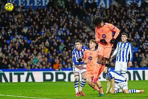 Barcelona's Jules Kounde makes an attempt to score during the Spanish La Liga soccer match between Real Sociedad and Barcelona in San Sebastian, Spain.