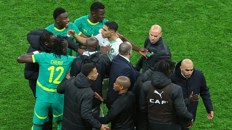 Morocco's Achraf Hakimi, center, clashes with Senegal players after a controversial penalty was awarded to Morocco late on during the Africa Cup of Nations final soccer match between Senegal and Morocco in Rabat, Morocco, Sunday, Jan. 18, 2026. - | Photo: AP/Youssef Loulidi