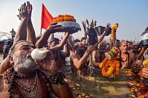 Seers perform rituals on the occasion of 'Mauni Amavasya' during the Magh Mela festival, at the Sangam in Prayagraj.