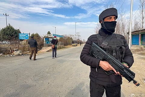 Security personnel keep vigil near Qazigund railway station amid high alert ahead of Republic Day celebrations, in Anantnag, Jammu and Kashmir.