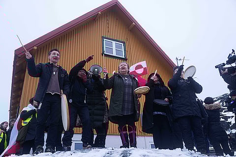 Inuits sing a national song during a protest against Trump's policy towards Greenland in front of the US consulate in Nuuk, Greenland.
