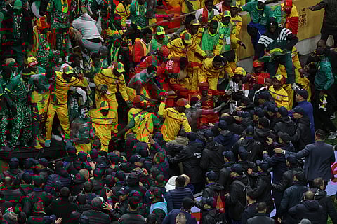 Senegal supporters clash with security services after a controversial penalty was awarded to Morocco late on during the Africa Cup of Nations final soccer match between Senegal and Morocco in Rabat, Morocco.