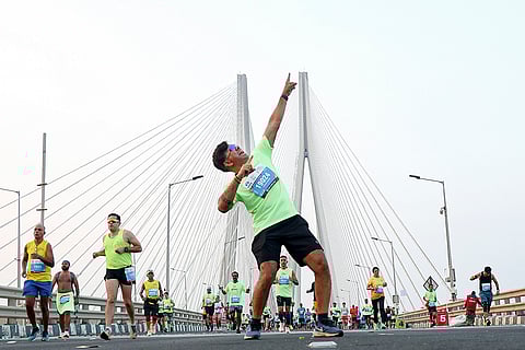 People take part in the Tata Mumbai Marathon 2026, on the Bandra-Worli Sea Link.