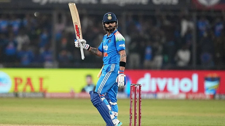 India's Virat Kohli celebrates his century during the third One Day International cricket match between India and New Zealand in Indore, India. - Photo: AP/Rafiq Maqbool